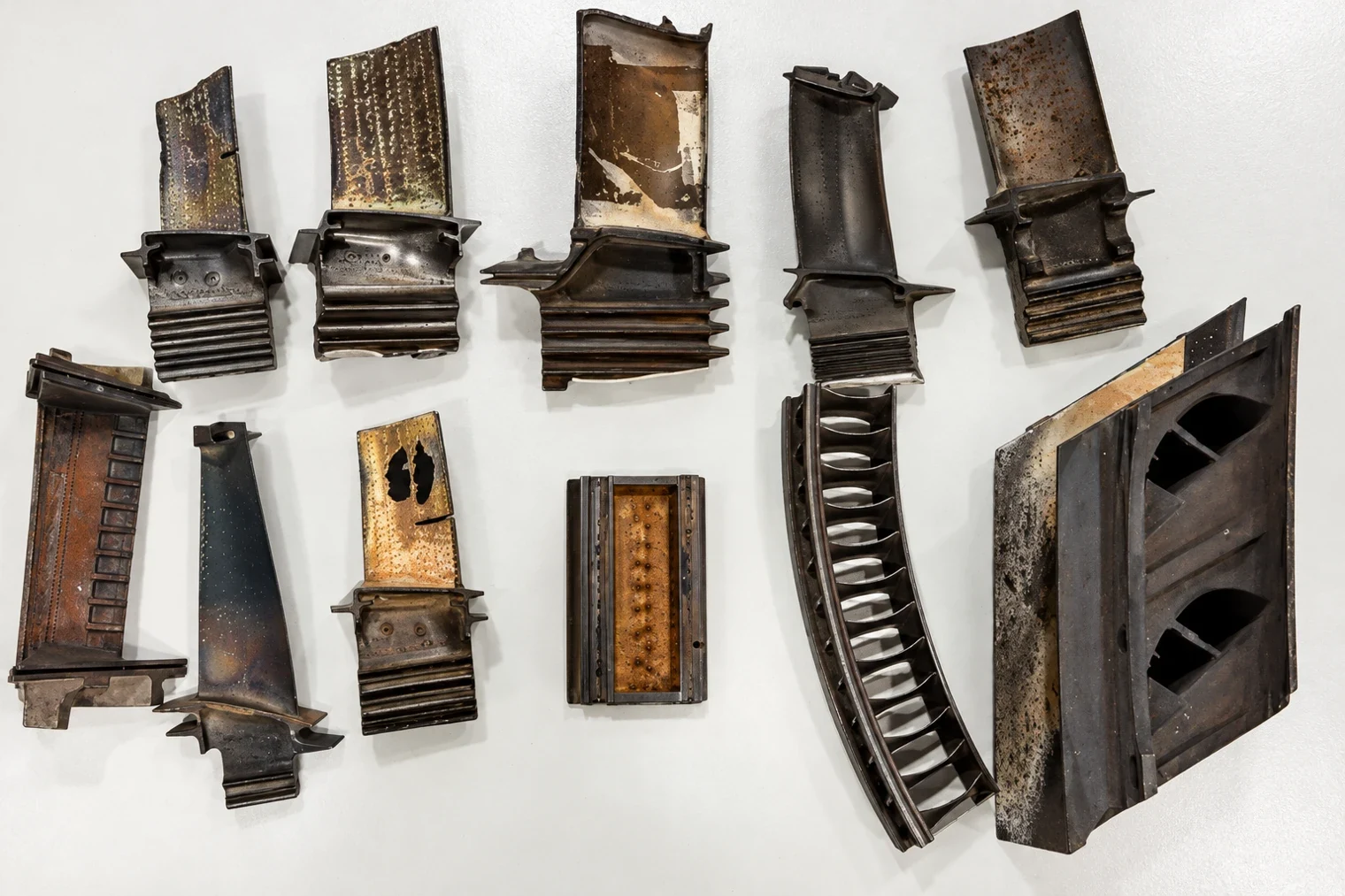 Contaminated aerospace platinum scrap turbine blades requiring sorting, testing, and specialized recovery cost evaluation.