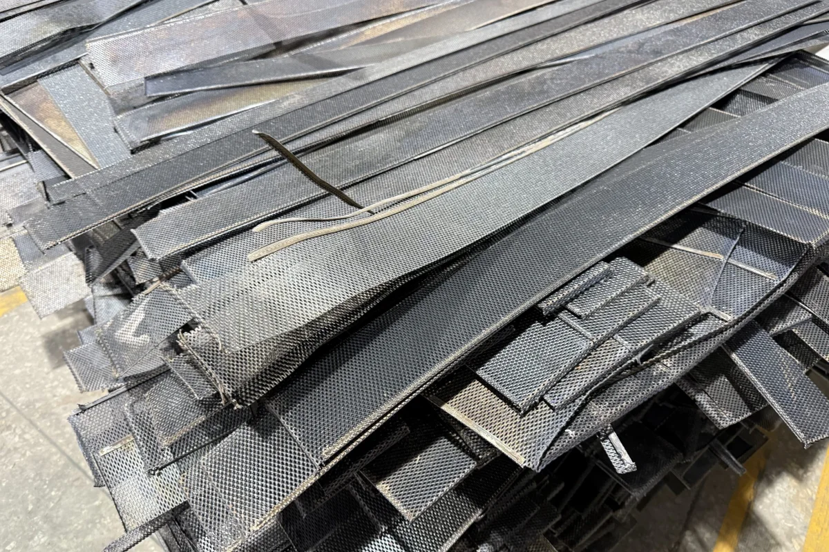 Flat titanium anode mesh panels awaiting recycling